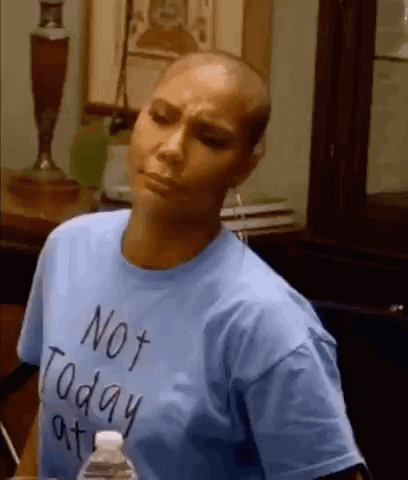 A Woman With A Shaved Head Is Wearing A Blue T-Shirt That Says Not Today At . GIF