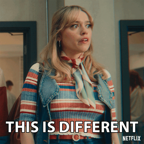A Woman With A Striped Shirt And A Denim Vest Says This Is Different GIF