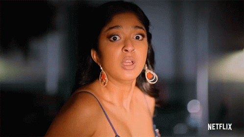 A Woman With A Surprised Look On Her Face And A Netflix Logo Behind Her GIF