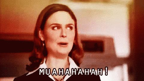A Woman With A Surprised Look On Her Face And The Words Muahahah Written Above Her GIF