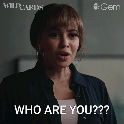 A Woman With A Surprised Look On Her Face Is Asking " Who Are You " GIF