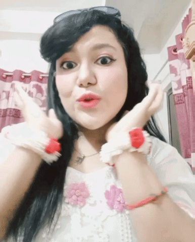 A Woman With A Surprised Look On Her Face Is Wearing Sunglasses GIF