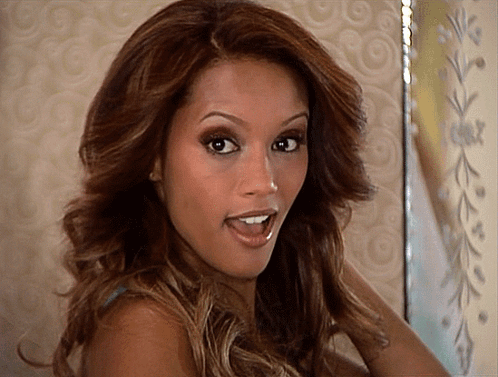 A Woman With A Surprised Look On Her Face Looks At The Camera GIF