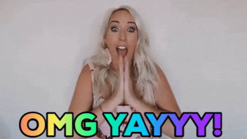 A Woman With A Surprised Look On Her Face Says Omg Yayyy ! GIF