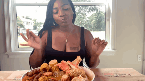 A Woman With A Tattoo On Her Chest Is Eating A Bowl Of Food GIF