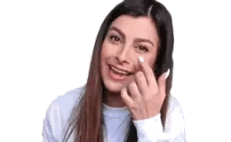 a woman with a tear coming out of her nose is smiling .