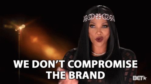 A Woman With A Tiara On Her Head Says We Don 'T Compromise The Brand GIF