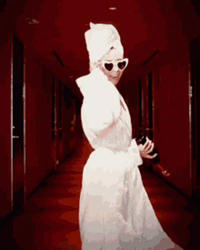 Woman With Towel On Head Holding Wine Bottle GIF
