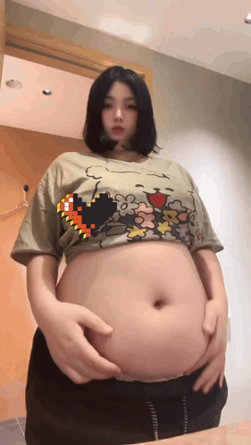 Woman With Large Belly Wearing Crop Top GIF