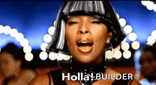 A Woman With A Wig On Her Head Is Singing A Song Called Holla Builder GIF