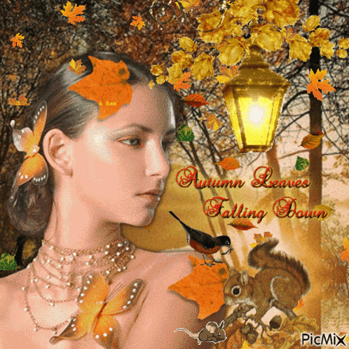 A Woman With Autumn Leaves Falling Down On Her Face GIF
