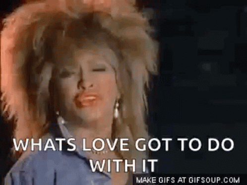 A Woman With Big Hair Is Singing A Song And Says `` Whats Love Got To Do With It '' . GIF