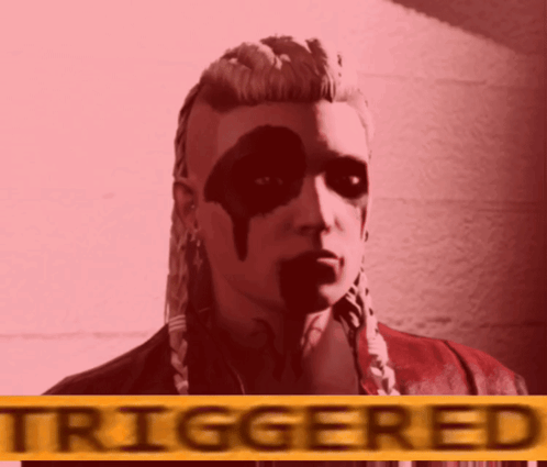 A Woman With Black Paint On Her Face Is Standing In Front Of A Sign That Says Triggered GIF