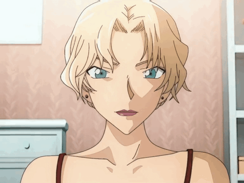 A Woman With Blonde Hair And Blue Eyes Is Wearing A Red Tank Top GIF