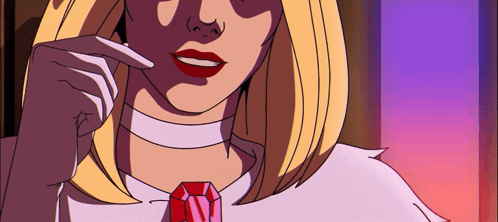 A Woman With Blonde Hair And Red Lips Is Wearing A Choker And A Red Necklace GIF