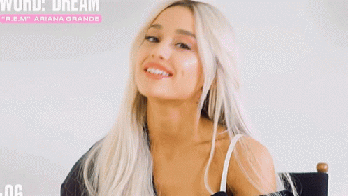 A Woman With Blonde Hair Is Sitting In A Chair With The Words World Dream Sneak Peek Above Her GIF