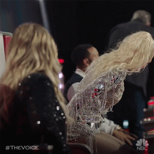 A Woman With Blonde Hair Is Sitting Next To Another Woman In A Nbc Ad GIF