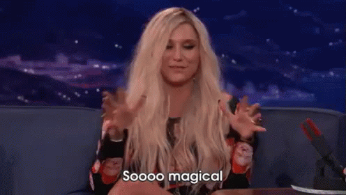A Woman With Blonde Hair Is Sitting On A Couch With Her Arms Outstretched And Says `` Soooo Magical '' . GIF
