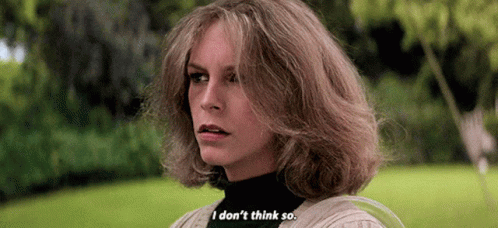 A Woman With Blonde Hair Is Standing In A Park And Says `` I Don 'T Think So '' . GIF