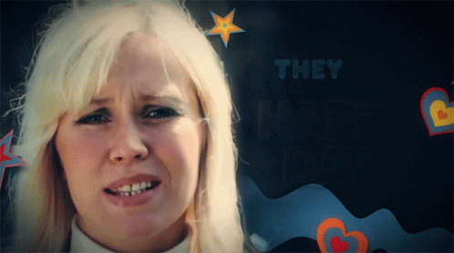 A Woman With Blonde Hair Is Surrounded By Hearts And The Words They Are Happy GIF