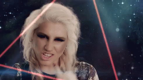 A Woman With Blonde Hair Is Surrounded By Red Lights GIF