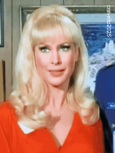 a woman with blonde hair is wearing a red shirt and a headband ..