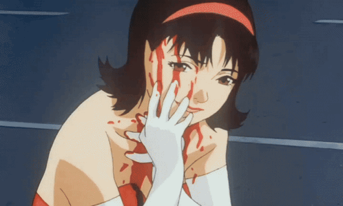 A Woman With Blood Coming Out Of Her Face Is Wearing White Gloves GIF