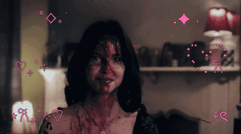 A Woman With Blood On Her Face Is Surrounded By Hearts And Arrows GIF