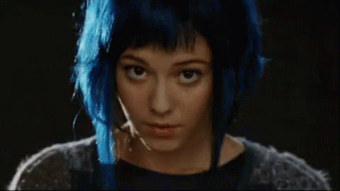A Woman With Blue Hair Has The Words Hey Hot Stuff On Her Face GIF