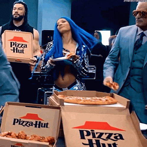 A Woman With Blue Hair Is Holding A Pizza Hut Pizza Box GIF