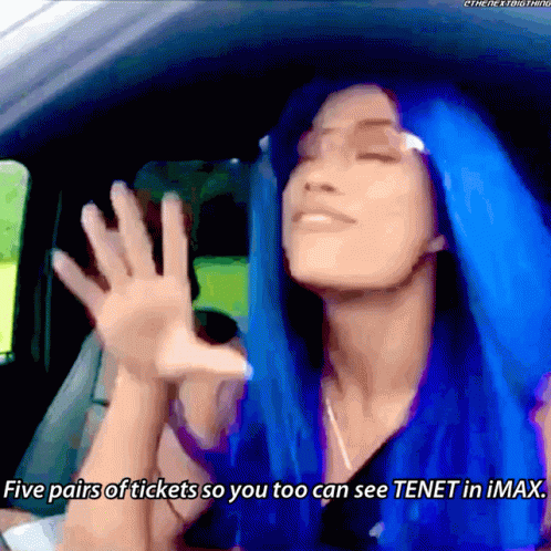 A Woman With Blue Hair Is In A Car And Says Five Pairs Of Tickets So You Too Can See Tenet In Imax GIF