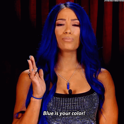 A Woman With Blue Hair Is Making A Face And Says Blue Is Your Color GIF