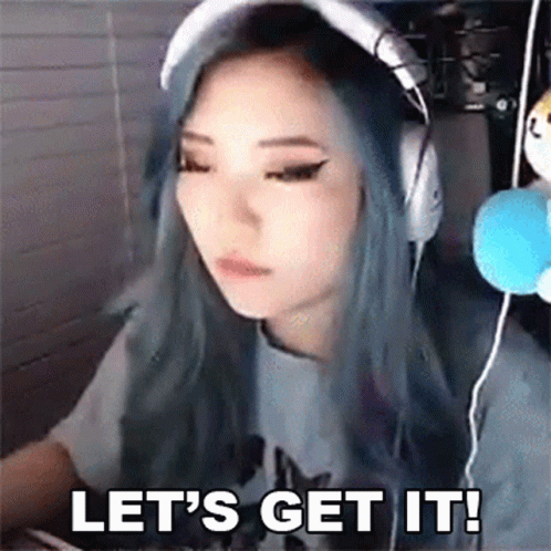 A Woman With Blue Hair Is Wearing Headphones And Says Let 'S Get It ! GIF