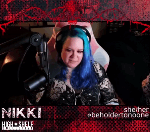 A Woman With Blue Hair Sitting In Front Of A Microphone With The Name Nikki GIF