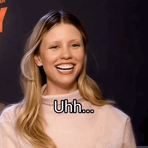 A Woman With Braces On Her Teeth Is Smiling With The Words Uhh Written On Her Face GIF