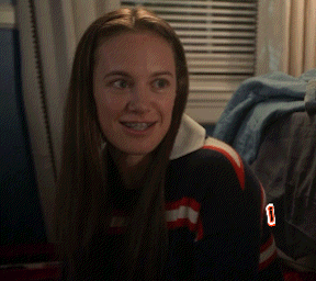 A Woman With Braces On Her Teeth Is Wearing A Jersey With The Number 0 On It GIF