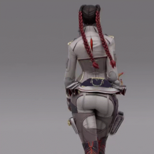 A Woman With Braids In Her Hair Is Walking GIF