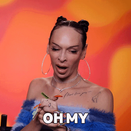 A Woman With Colorful Nails Is Holding Her Hands Together And Says Oh My GIF