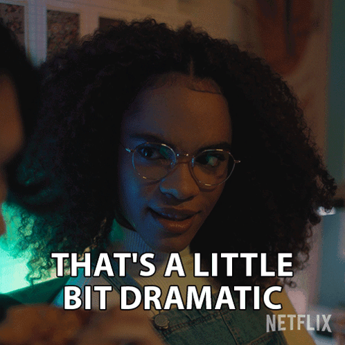 A Woman With Curly Hair And Glasses Says " That 'S A Little Bit Dramatic " GIF