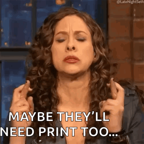 A Woman With Curly Hair Is Crossing Her Fingers And Saying Maybe They 'Ll Need Print Too ... GIF