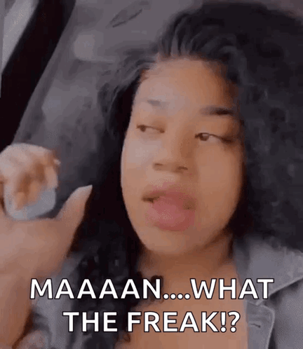 A Woman With Curly Hair Is Making A Funny Face And Saying What The Freak . GIF