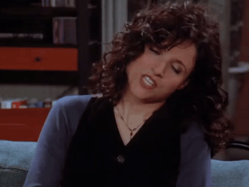 A Woman With Curly Hair Is Sitting On A Couch And Says You Know What Why Don T You Just Shut The Hell Up ... GIF