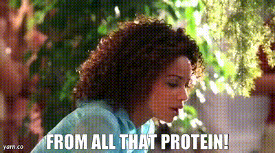 A Woman With Curly Hair Is Talking About Protein . GIF