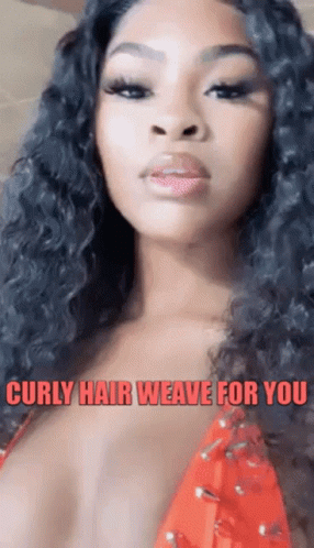 A Woman With Curly Hair Is Wearing A Red Top And A Caption That Says Curly Hair Weave For You . GIF