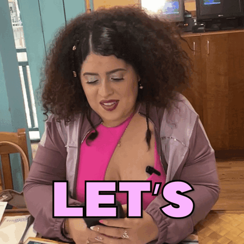 A Woman With Curly Hair Says Let 'S In Pink GIF
