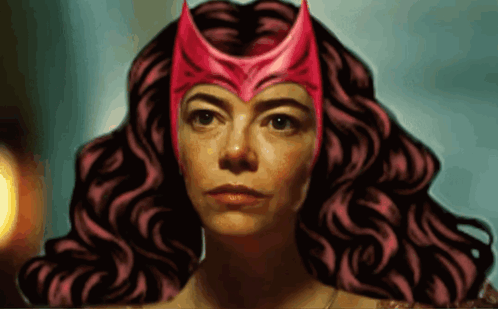 a woman with curly hair wearing a red helmet