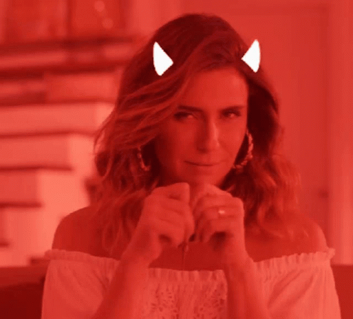 A Woman With Devil Horns On Her Head And A Tail GIF