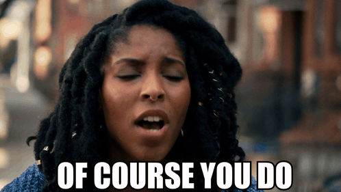 A Woman With Dreadlocks Is Making A Face And Says Of Course You Do GIF