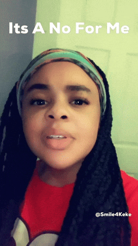 A Woman With Dreadlocks Is Wearing A Headband And A Red Shirt With The Words It 'S A No For Me GIF