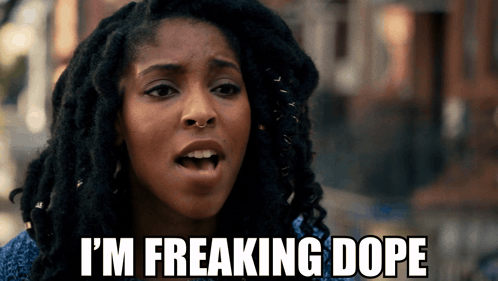 A Woman With Dreadlocks Says " I 'M Freaking Dope " In Front Of Her Face GIF